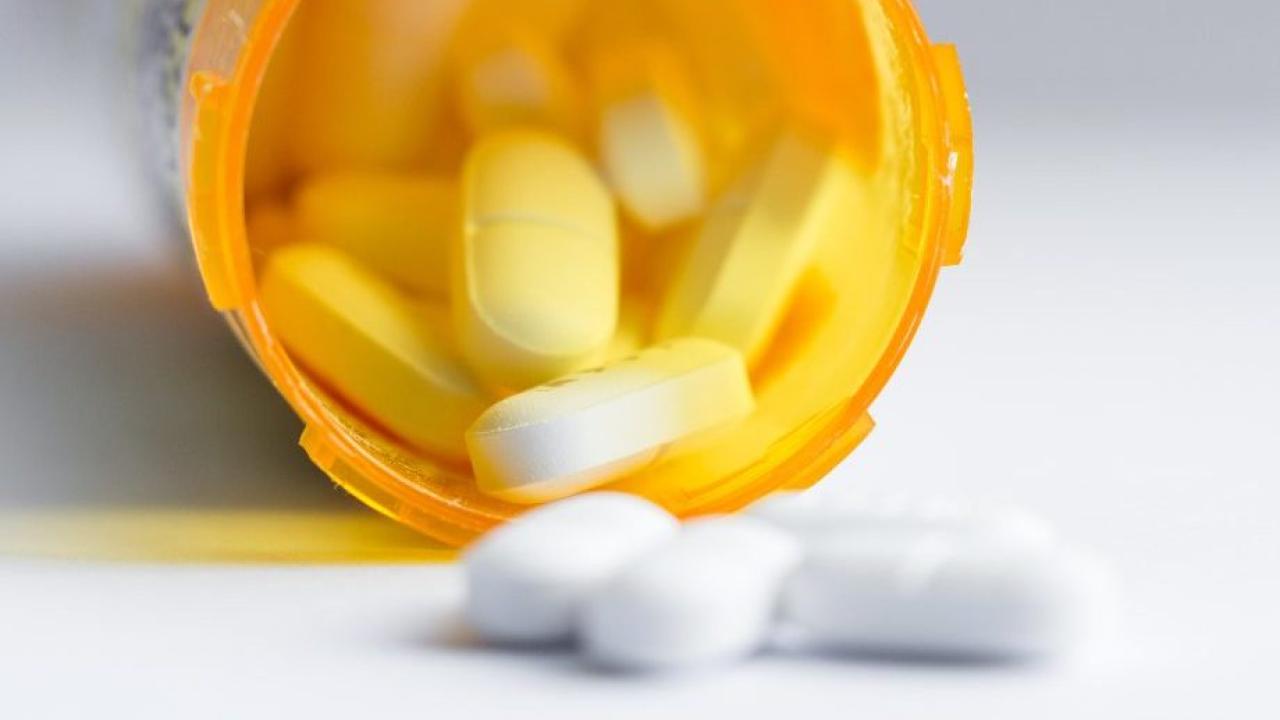 Unidentified pills spilling from container
